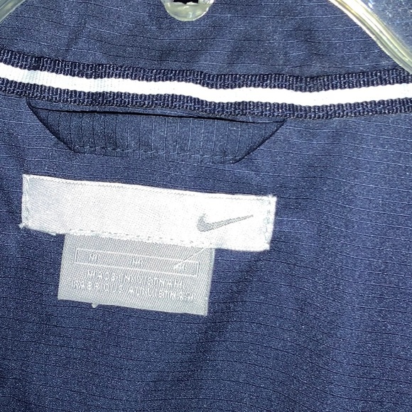 NWOT! Men’ medium Nike Jacket. Navy w/ white and gold stripes. Side zip pockets - Picture 3 of 4